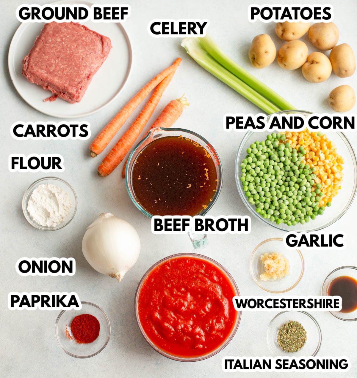 Ingredients in Slow Cooker Ground Beef and Vegetable Soup on a light gray background with black labels.