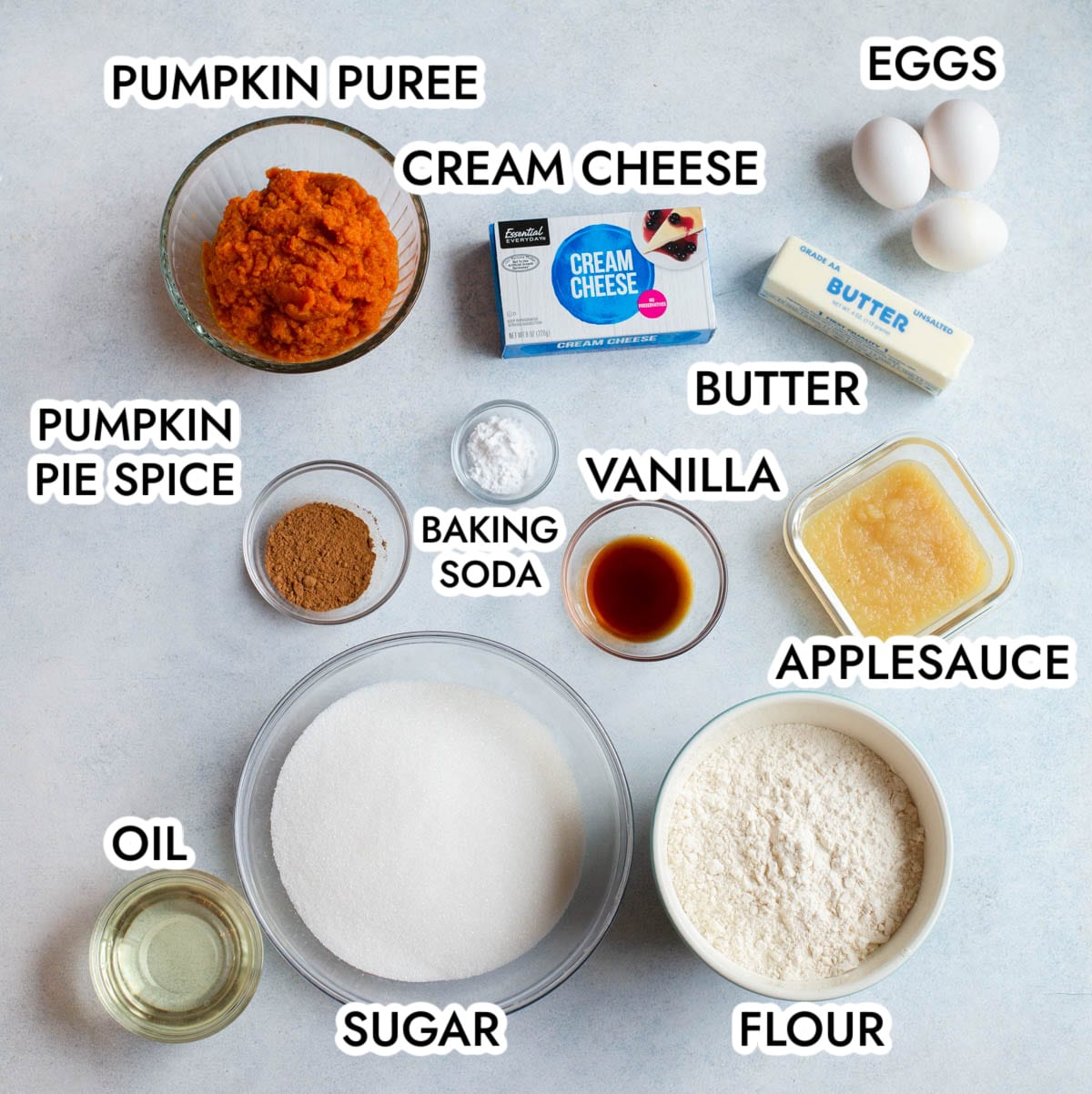 Ingredients in pumpkin bundt cake with brown butter frosting on a gray background.